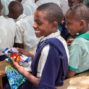 SAG Kit Distribution image showing Kanguli Comprehensive School girls receiving 71 kits in Kanguli, Kenya on Feb 21, 2026