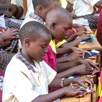 SAG Kit Distribution image showing Nandereka Comprehensive School girls receiving 74 kits in Nandereka, Kenya on Mar 17, 2026