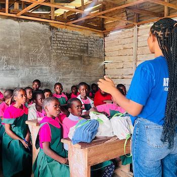 SAG Kit Distribution image showing Shalom Primary School girls receiving 65 kits in Bokova, Cameroon on Mar 24, 2026