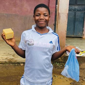 SAG Kit Distribution image showing Mercy Bilingual Primary School girls receiving 80 kits in Wonya, Cameroon on May 14, 2026