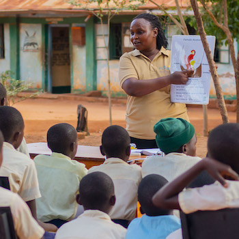 SAG Kit Distribution image showing St. Philip's Vote Comprehensive School girls receiving 46 kits in Kitui, Kenya on May 14, 2026
