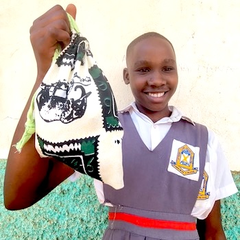 SAG Kit Distribution image showing Busiika Umea Primary School girls receiving 52 kits in Busiika, Uganda on May 26, 2026
