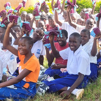 SAG Kit Distribution image showing Bugungu Primary School girls receiving 152 kits in Njeru, Uganda on June 2, 2026