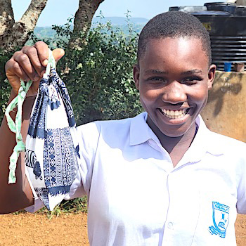 SAG Kit Distribution image showing Bugungu Primary School girls receiving 152 kits in Njeru, Uganda on June 2, 2026