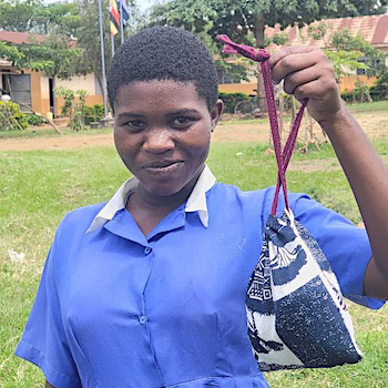 SAG Kit Distribution image showing St Mary's Kiryowa Primary School girls receiving 315 kits in Njeru, Uganda on June 2, 2026