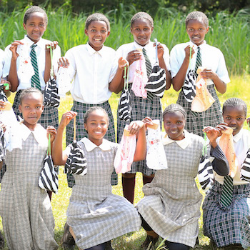 SAG Kit Distribution image showing Kihuro Primary School girls receiving 140 kits in Kihuro, Kenya on June 11, 2026