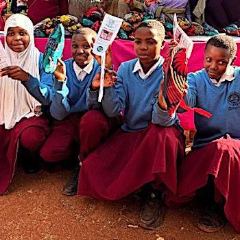 SAG Kit Distribution image showing Banjika Secondary School girls receiving 252 kits in Qurus, Tanzania on June 23, 2026
