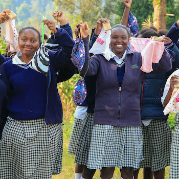 SAG Kit Distribution image showing Tumutumu Secondary School girls receiving 125 kits in Karatina, Kenya on July 3, 2026