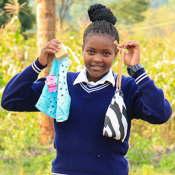 SAG Kit Distribution image showing Tumutumu Secondary School girls receiving 125 kits in Karatina, Kenya on July 3, 2026
