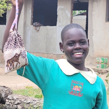 SAG Kit Distribution image showing Bibbo Primary School girls receiving 120 kits in Nansana, Uganda on July 9, 2026