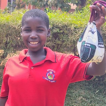 SAG Kit Distribution image showing Migadde Primary School girls receiving 230 kits in Nansana, Uganda on July 9, 2026