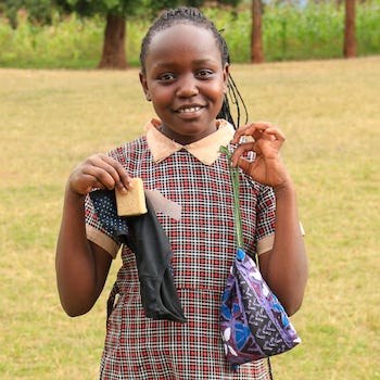 SAG Kit Distribution image showing Ngurumo Primary School girls receiving 137 kits in Karogoto, Kenya on July 10, 2026