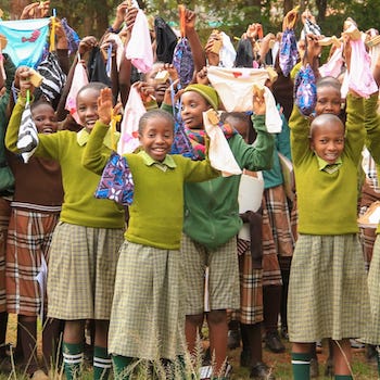 SAG Kit Distribution image showing Ngunguru Primary School girls receiving 242 kits in Karogoto, Kenya on July 17, 2026